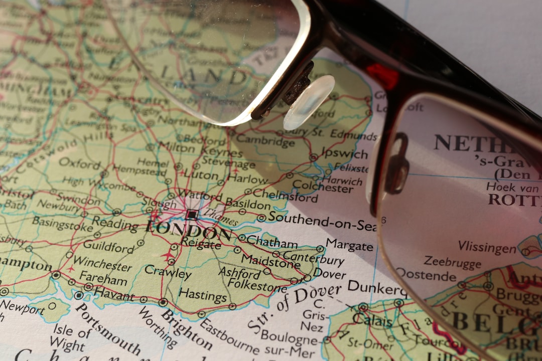 a pair of glasses sitting on top of a map, Lets take a look at our next destination
