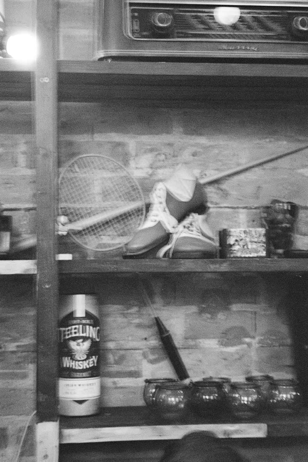 a black and white photo of a racket and tennis rackets