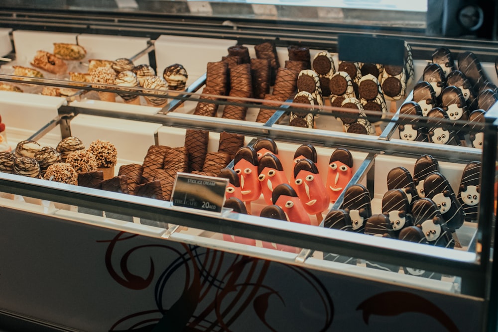 a display case filled with lots of different types of desserts