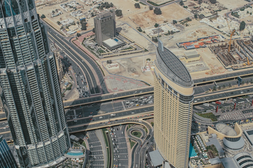 an aerial view of a city with tall buildings