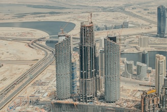 a large group of tall buildings under construction