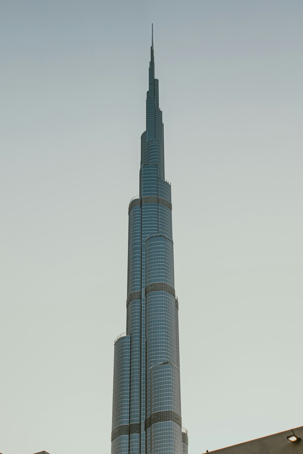 a very tall building towering over a city