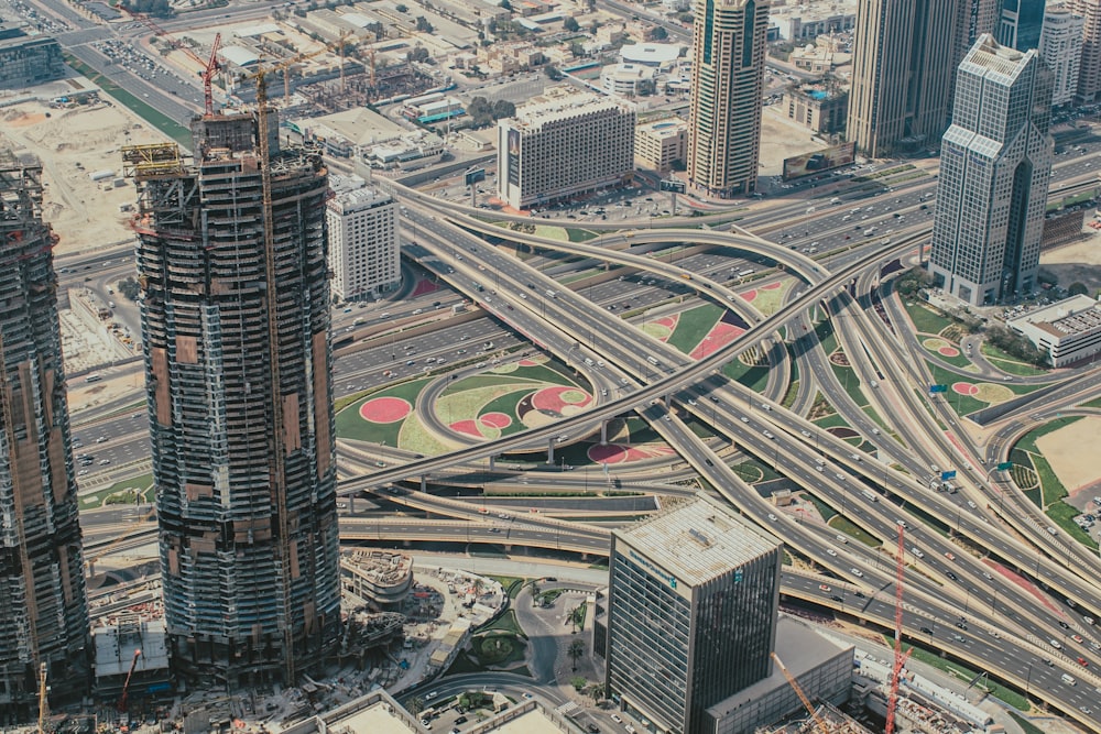 an aerial view of a highway intersection in a city