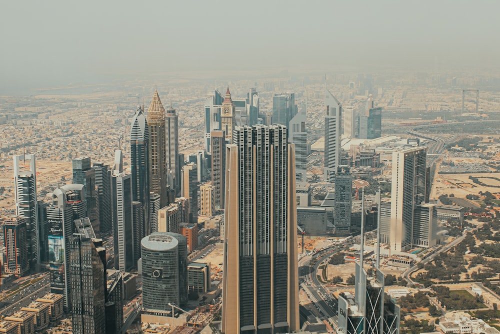 an aerial view of a city with tall buildings