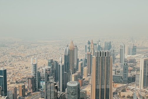 An aerial view of a modern city skyline with financial districts.