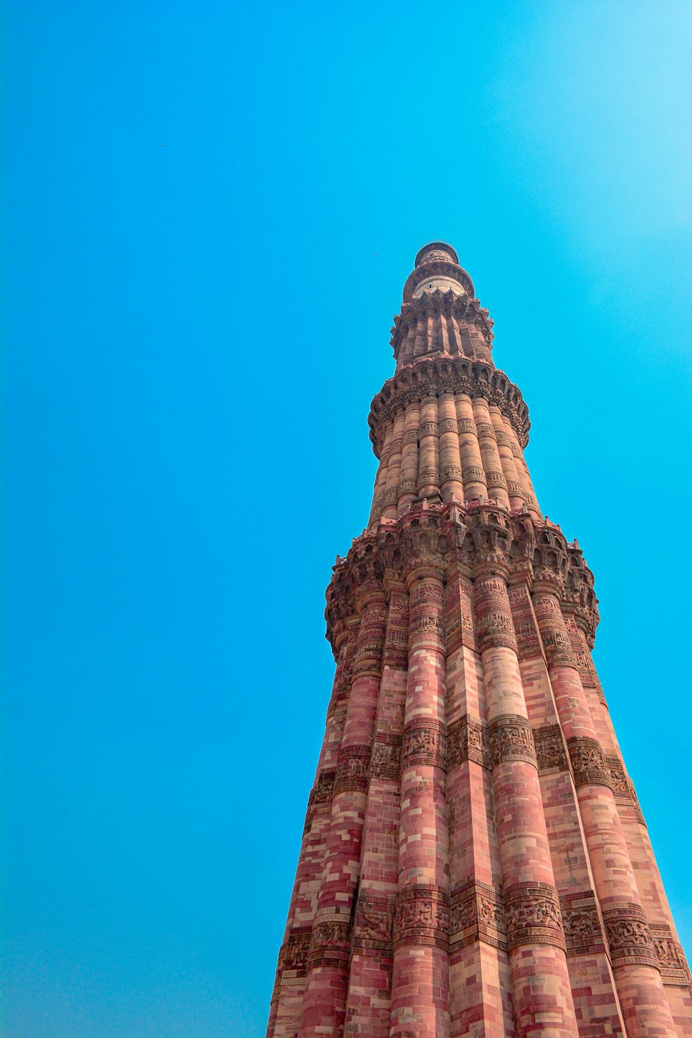 a tall tower with a clock on the top of it