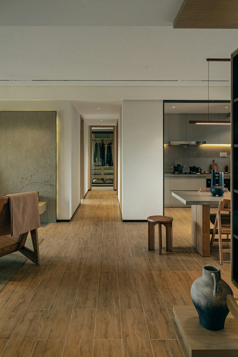 a living room filled with furniture and a wooden floor