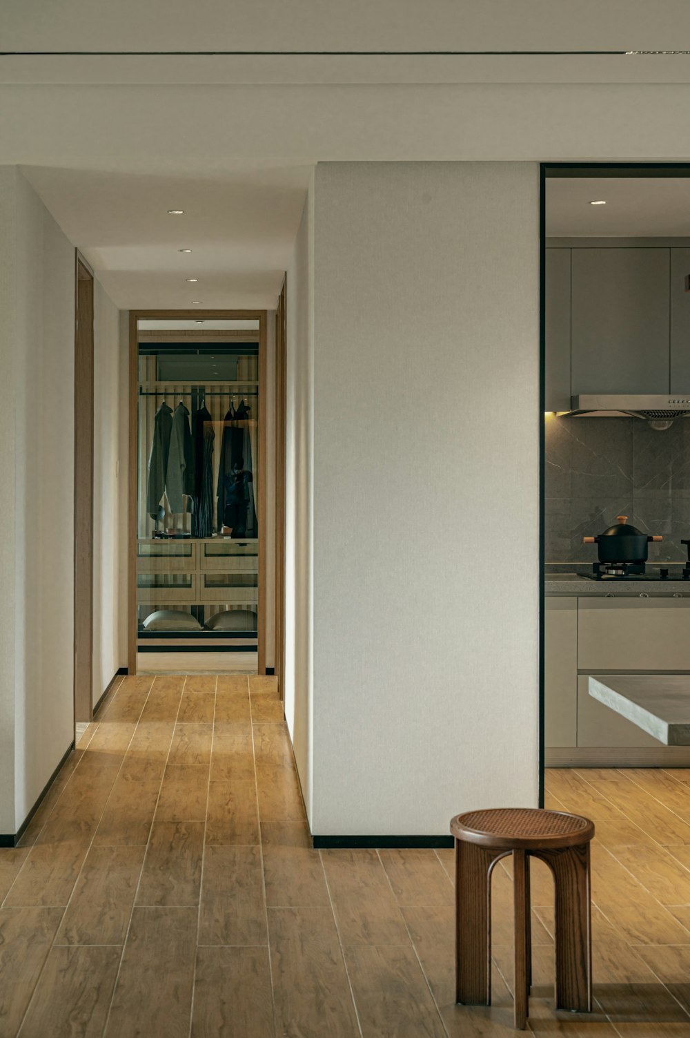 a room with a wooden floor and white walls