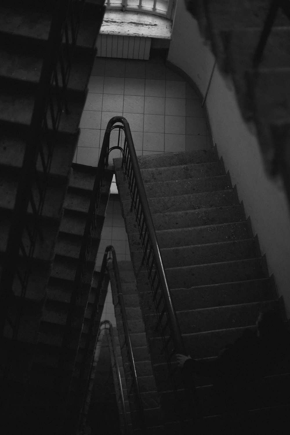 a black and white photo of an escalator