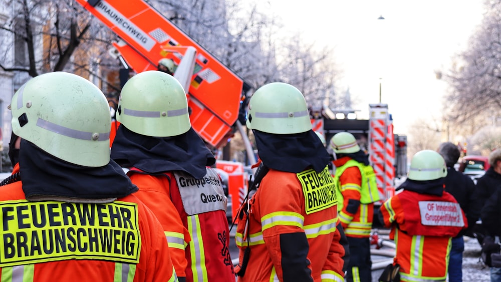 a group of construction workers standing next to each other