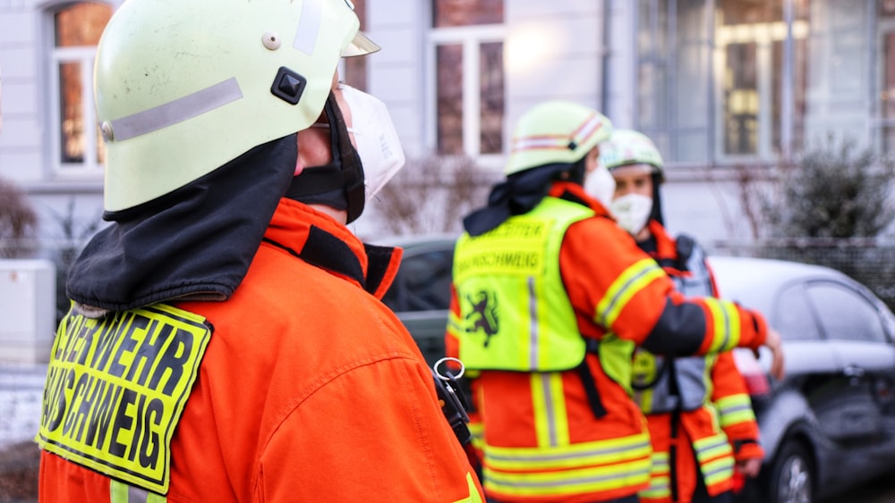 a group of firemen standing next to each other