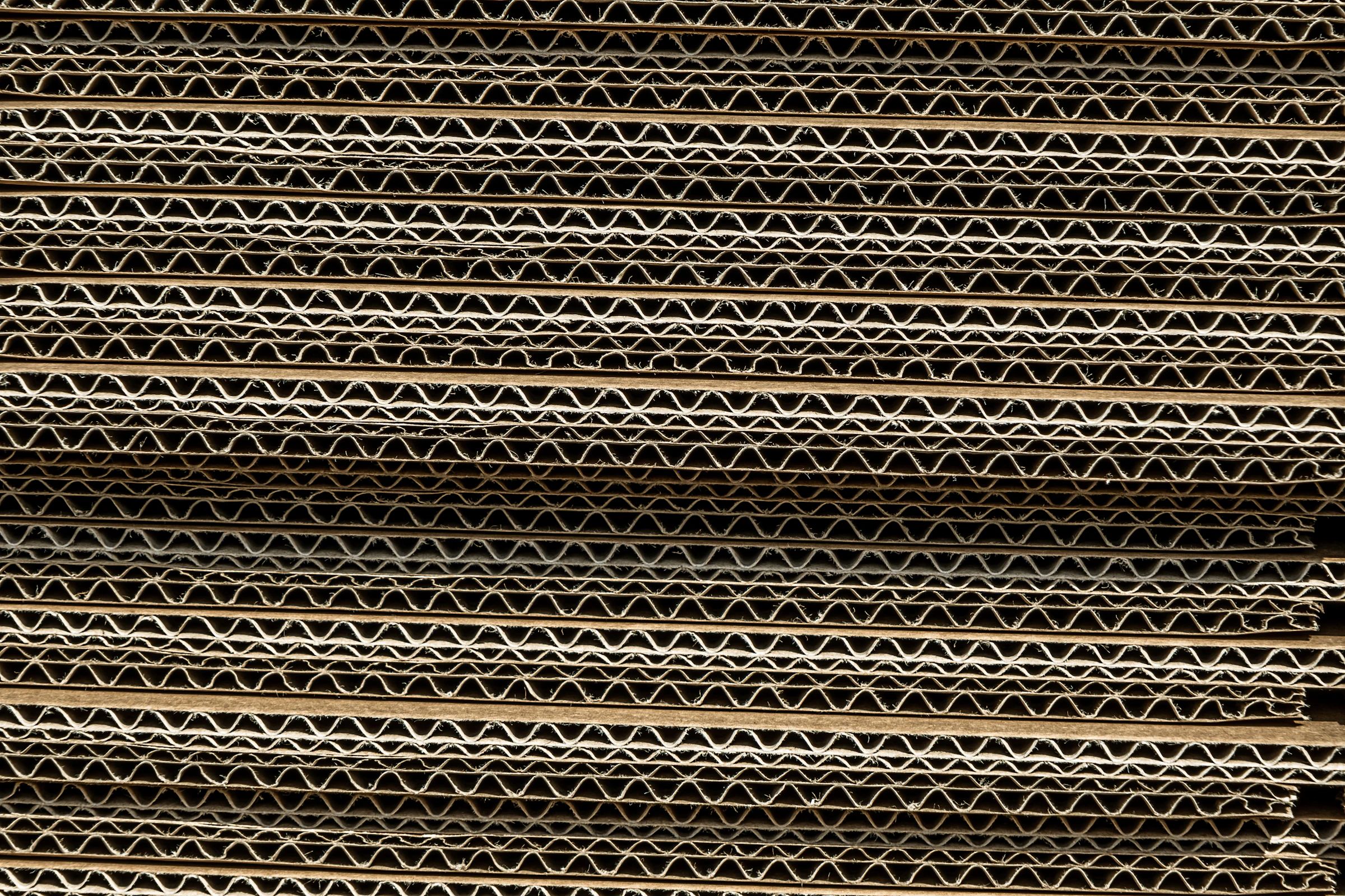 Close-up of corrugated cardboard material texture used in high-density packaging freight
