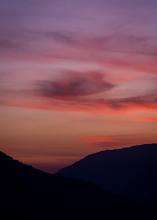 Beautiful sunset over the mountains of Hainan with soft pastel colors in the sky.