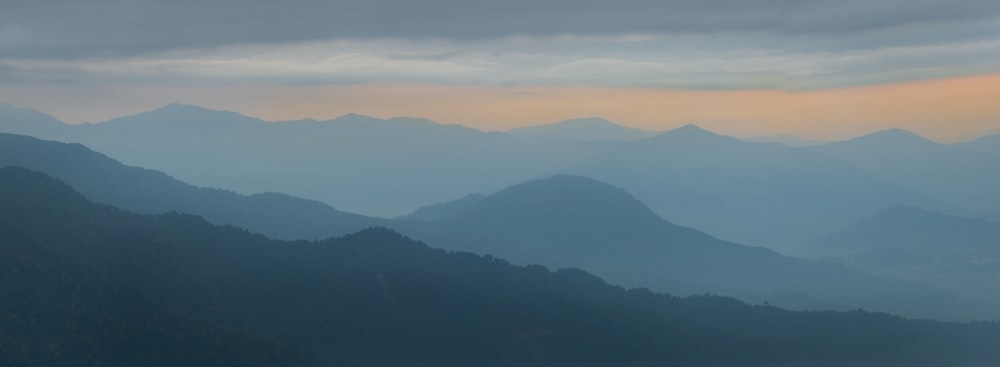 a view of a mountain range at sunset