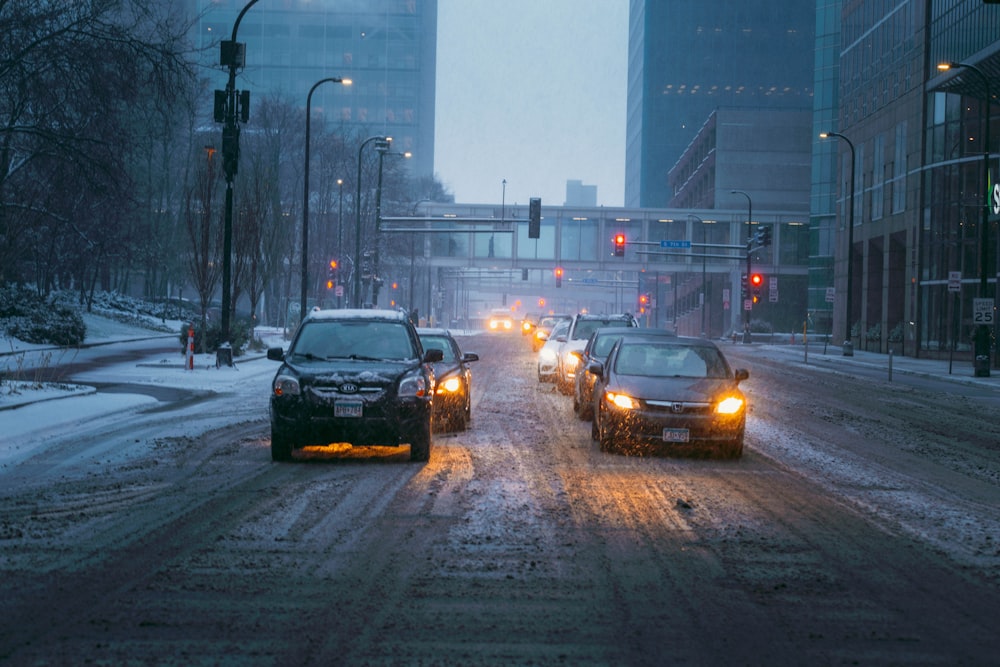 a couple of cars that are sitting in the snow