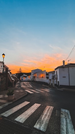 Portuguese street in Lisbon at sunset, warm tones highlighting a peaceful evening.