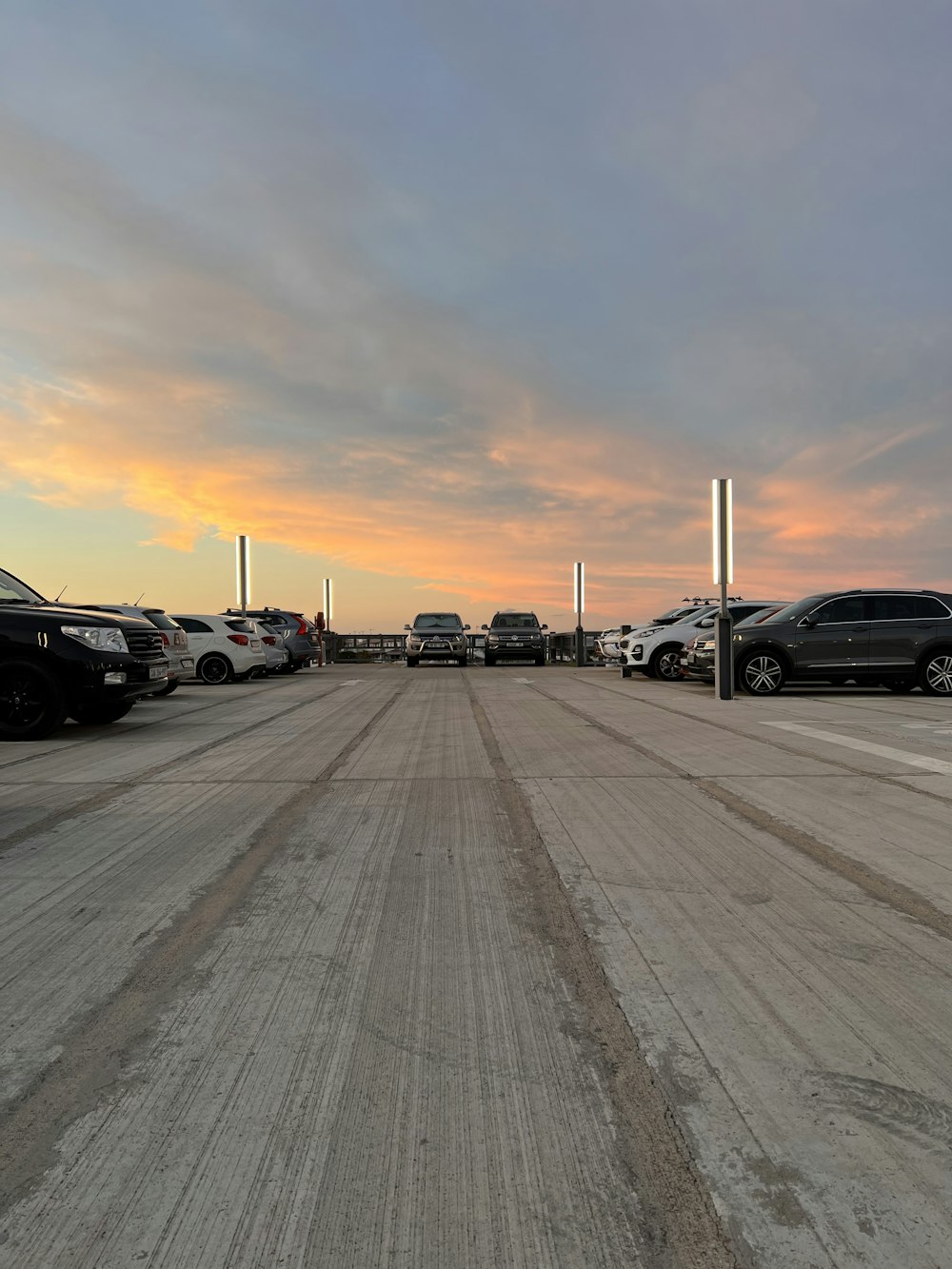 a parking lot filled with lots of parked cars