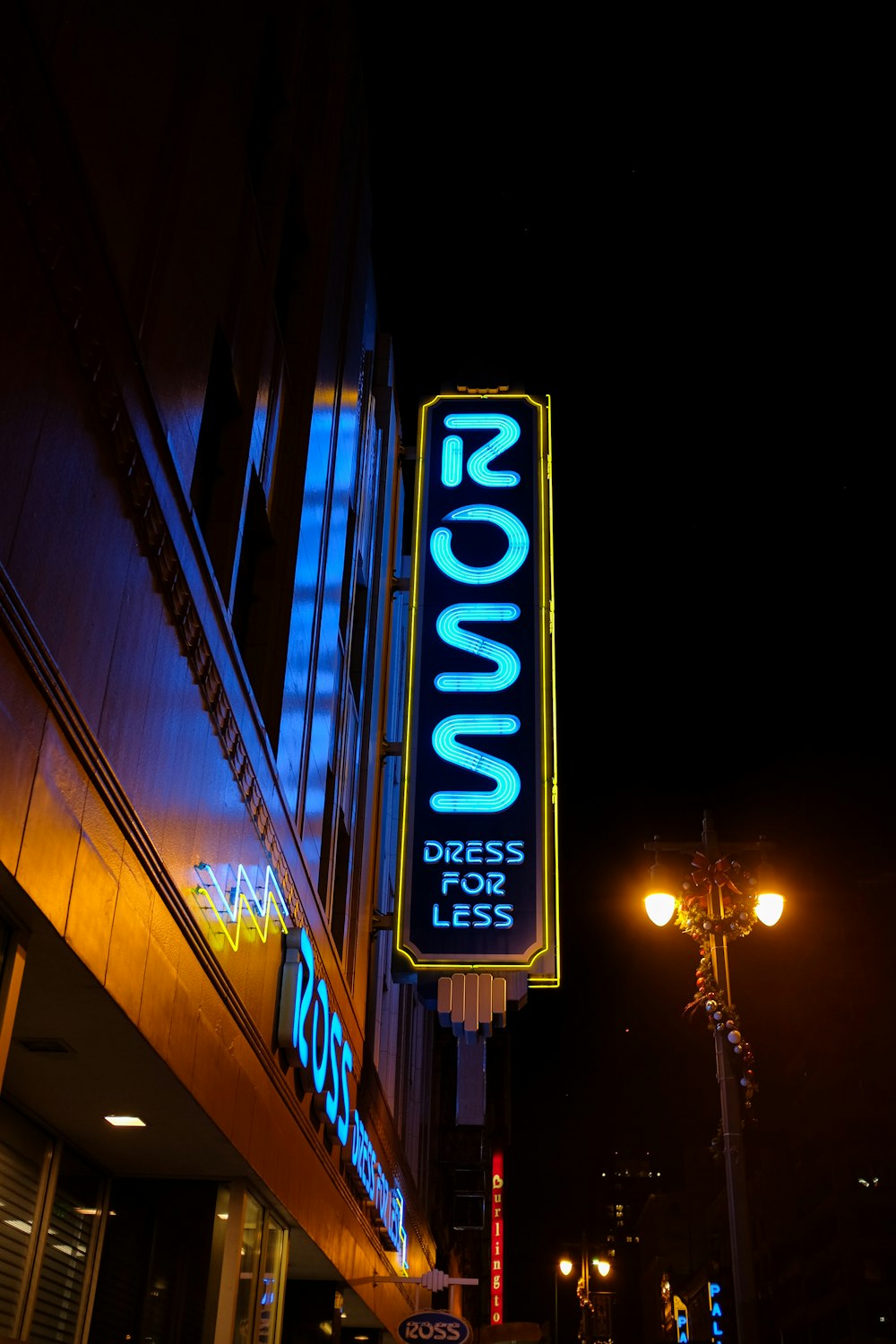 a neon sign on the side of a building