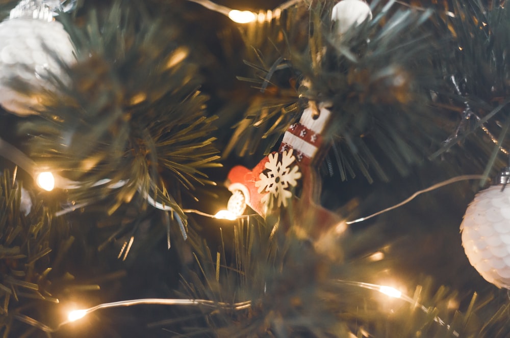 a close up of a christmas ornament on a tree