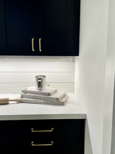 A row of heavy-duty cutting boards and mixing bowls stacked in a professional kitchen setting.