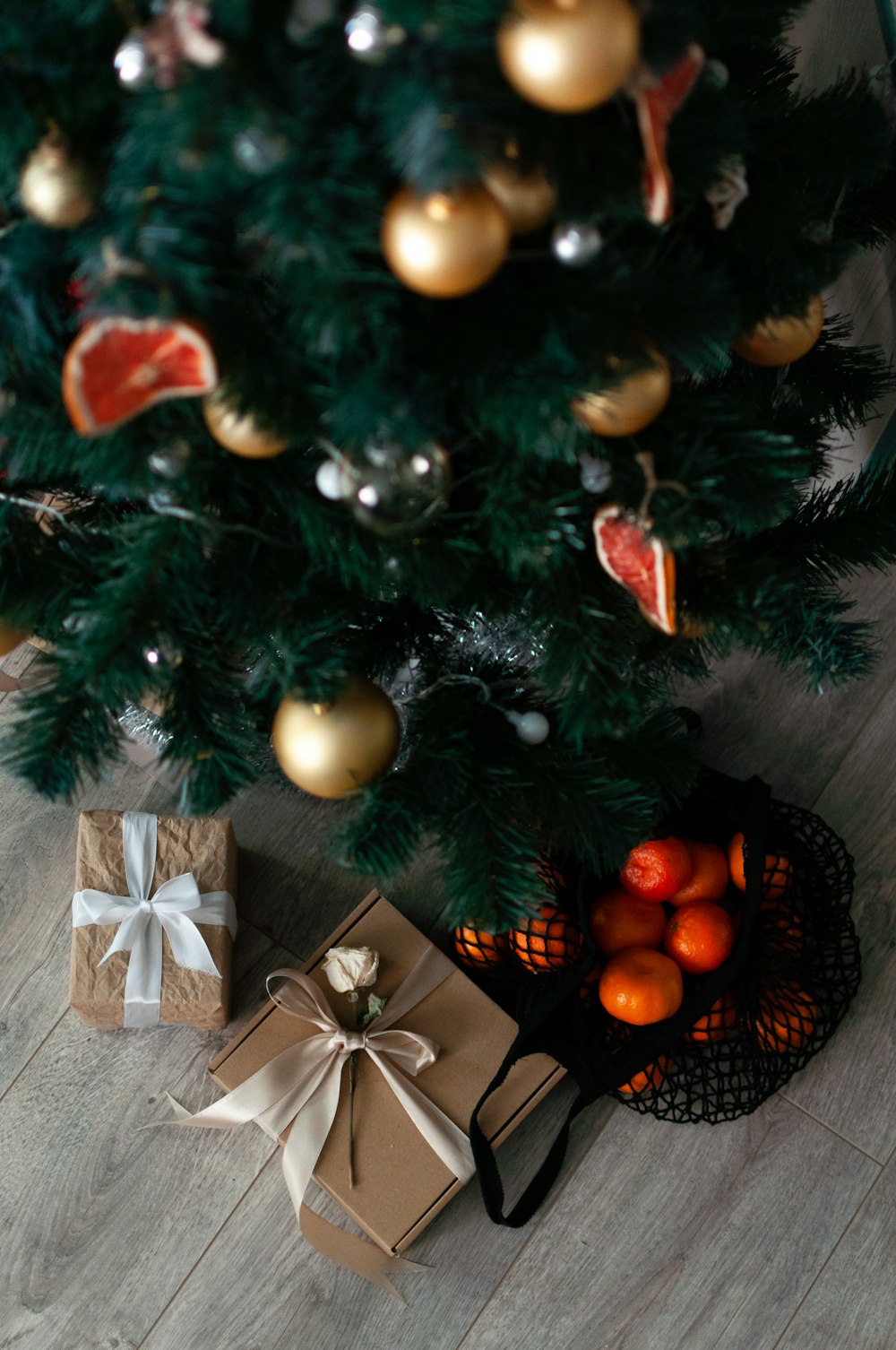 a christmas tree with presents under it