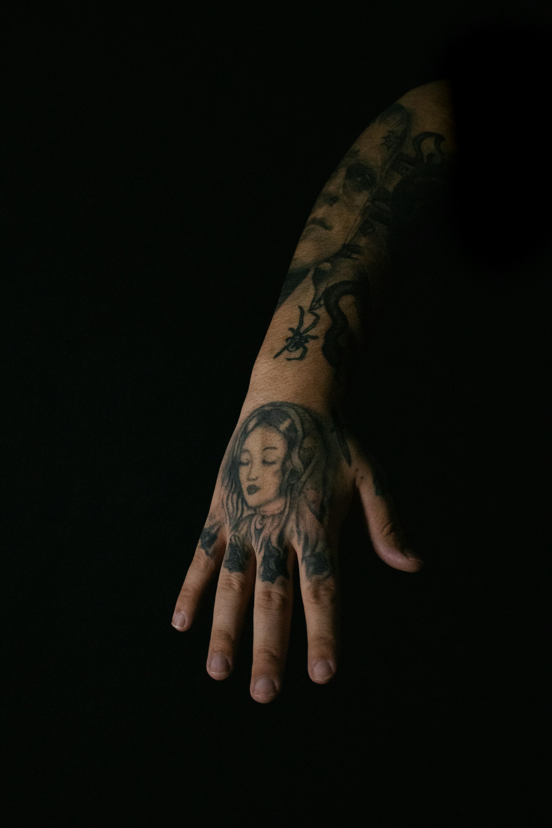 a person's hand with a tattoo on it