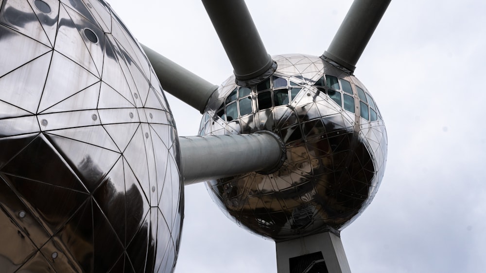 a large metal object with a sky background