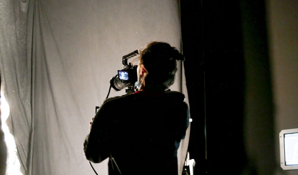 a man is taking a picture of himself in the mirror