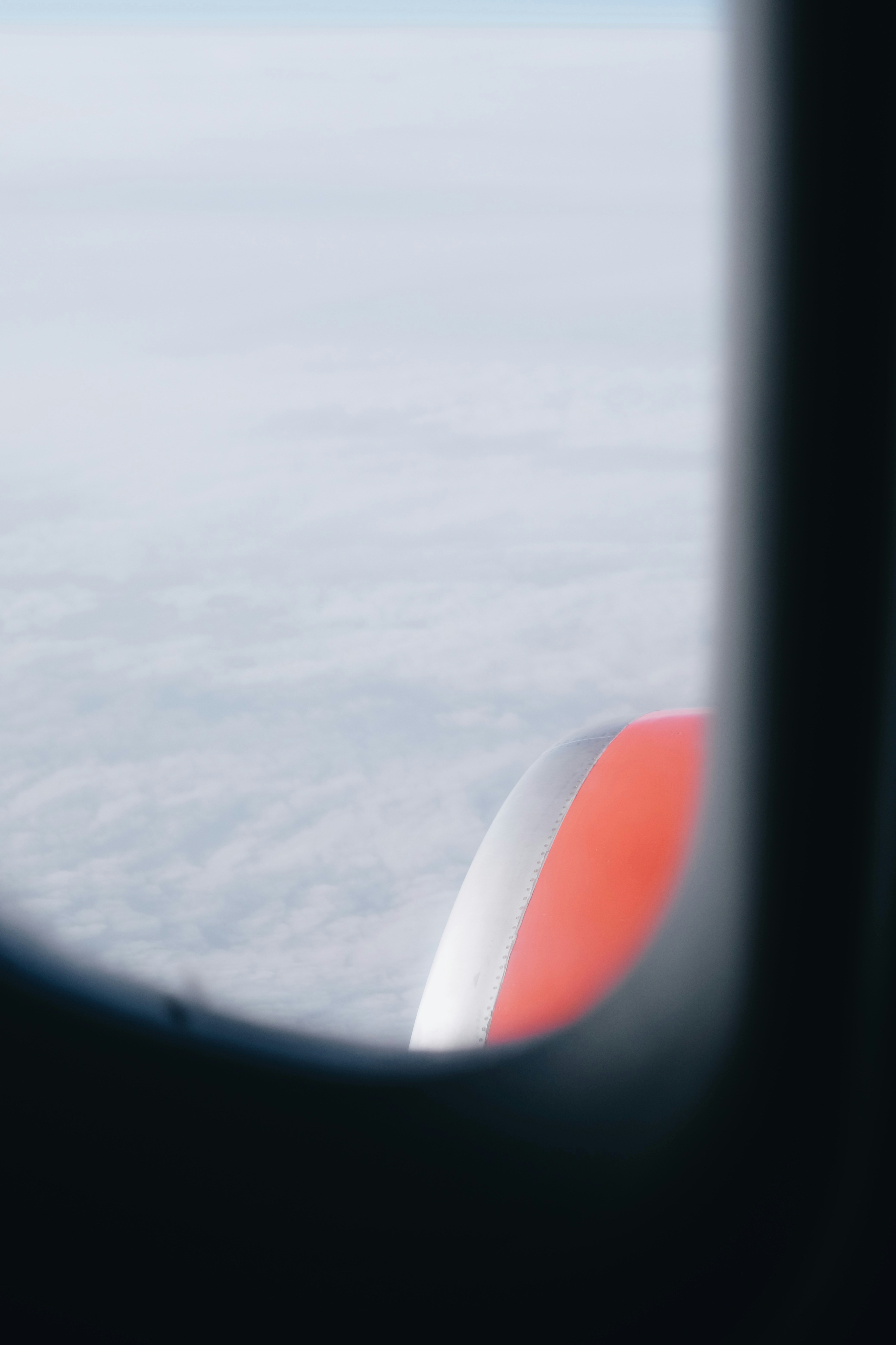 a view of the wing of an airplane through a window