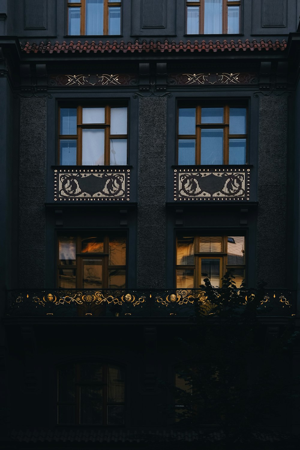 a black building with windows and a balcony