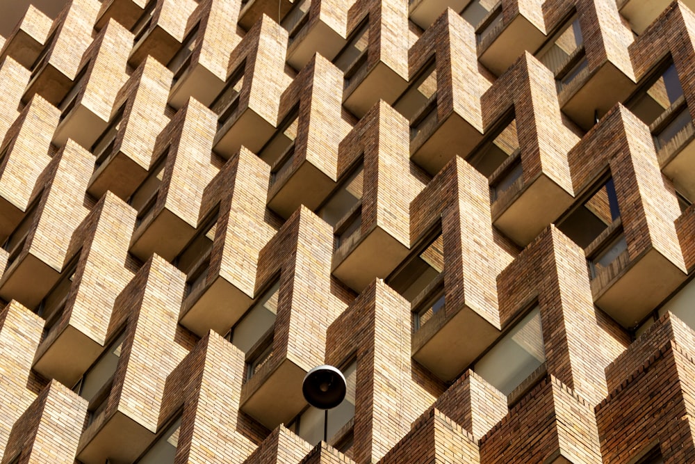 a clock on a pole in front of a building