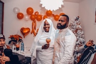 A happy couple happily celebrating in their home, reflecting the joy of getting a Prestamopro loan to build their future.