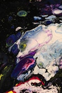 A vibrant painting featuring abstract shapes in lilac and purple.