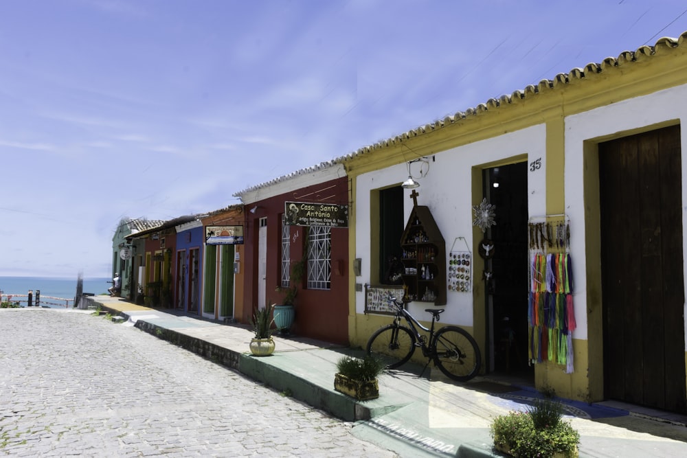 a bike is parked outside of a colorful building