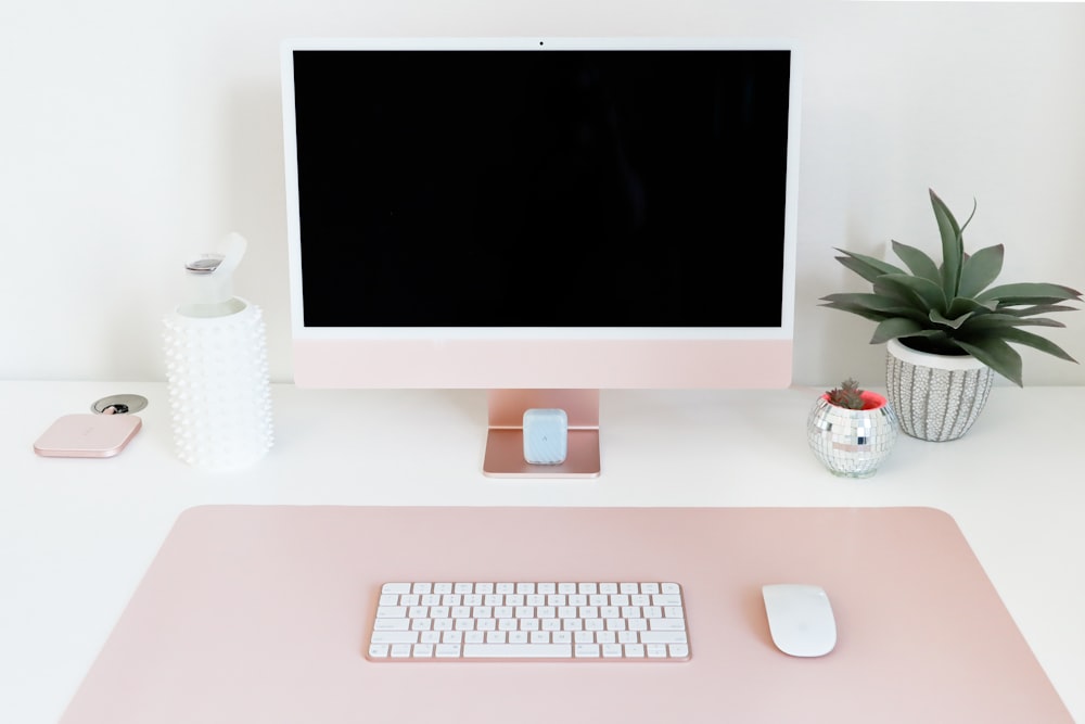 a computer monitor sitting on top of a desk