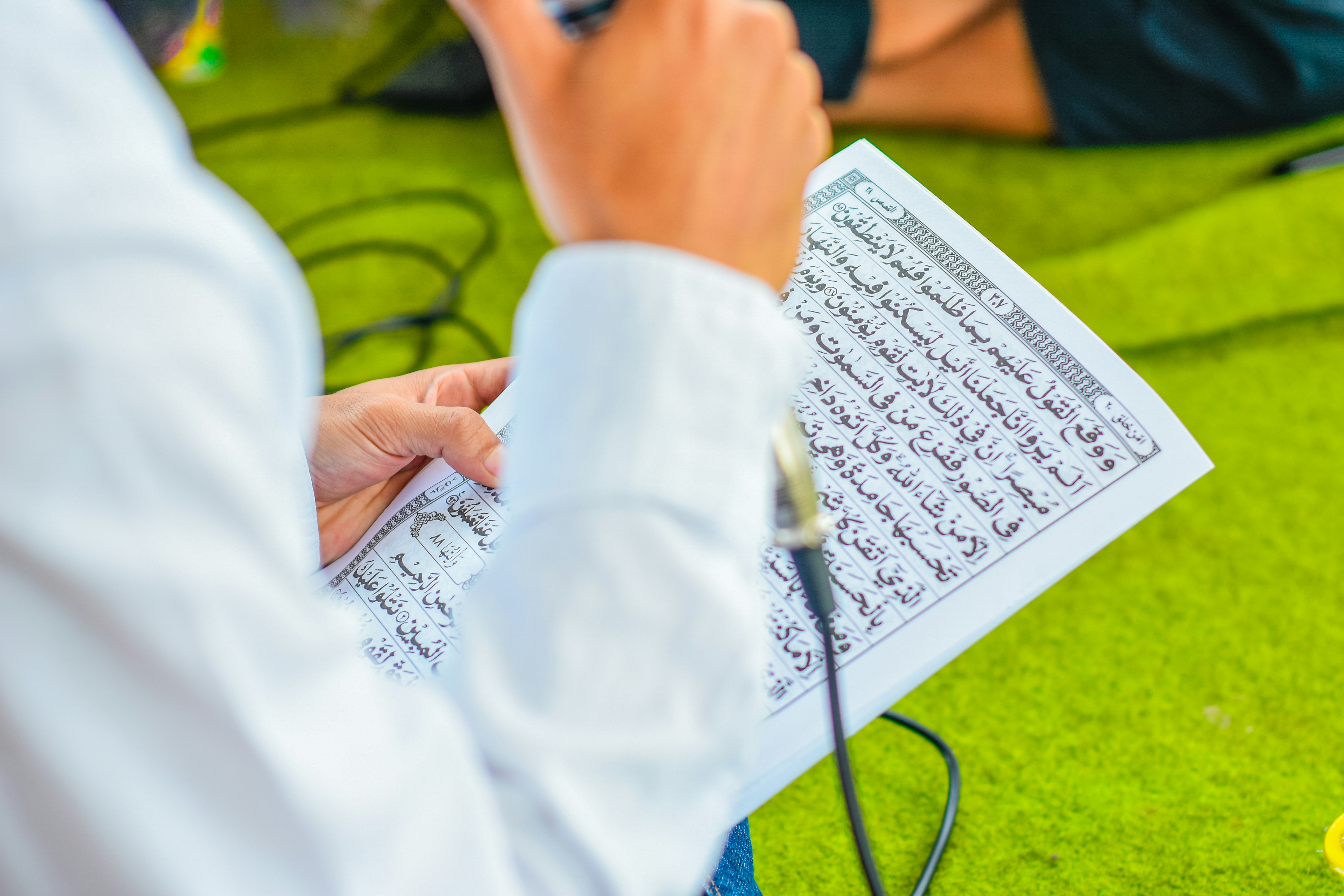 a person is writing on a piece of paper