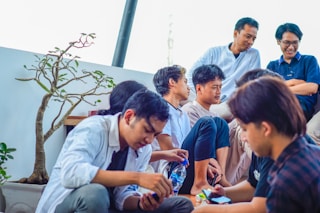 a group of people sitting next to each other