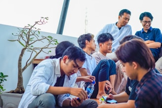 a group of people sitting next to each other