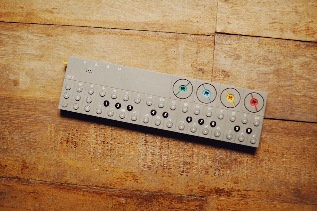 a remote control sitting on top of a wooden table