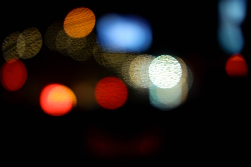 a blurry photo of a city street at night