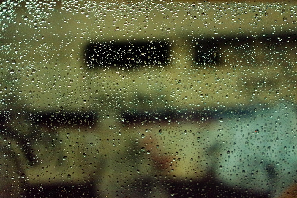 a close up of a window with rain drops