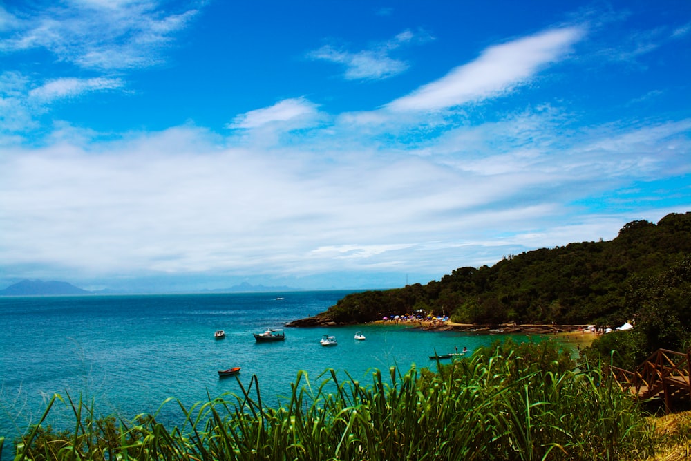 a body of water with boats floating on top of it