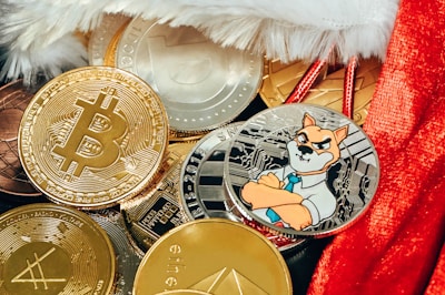 a pile of bitcoins sitting on top of a red blanket