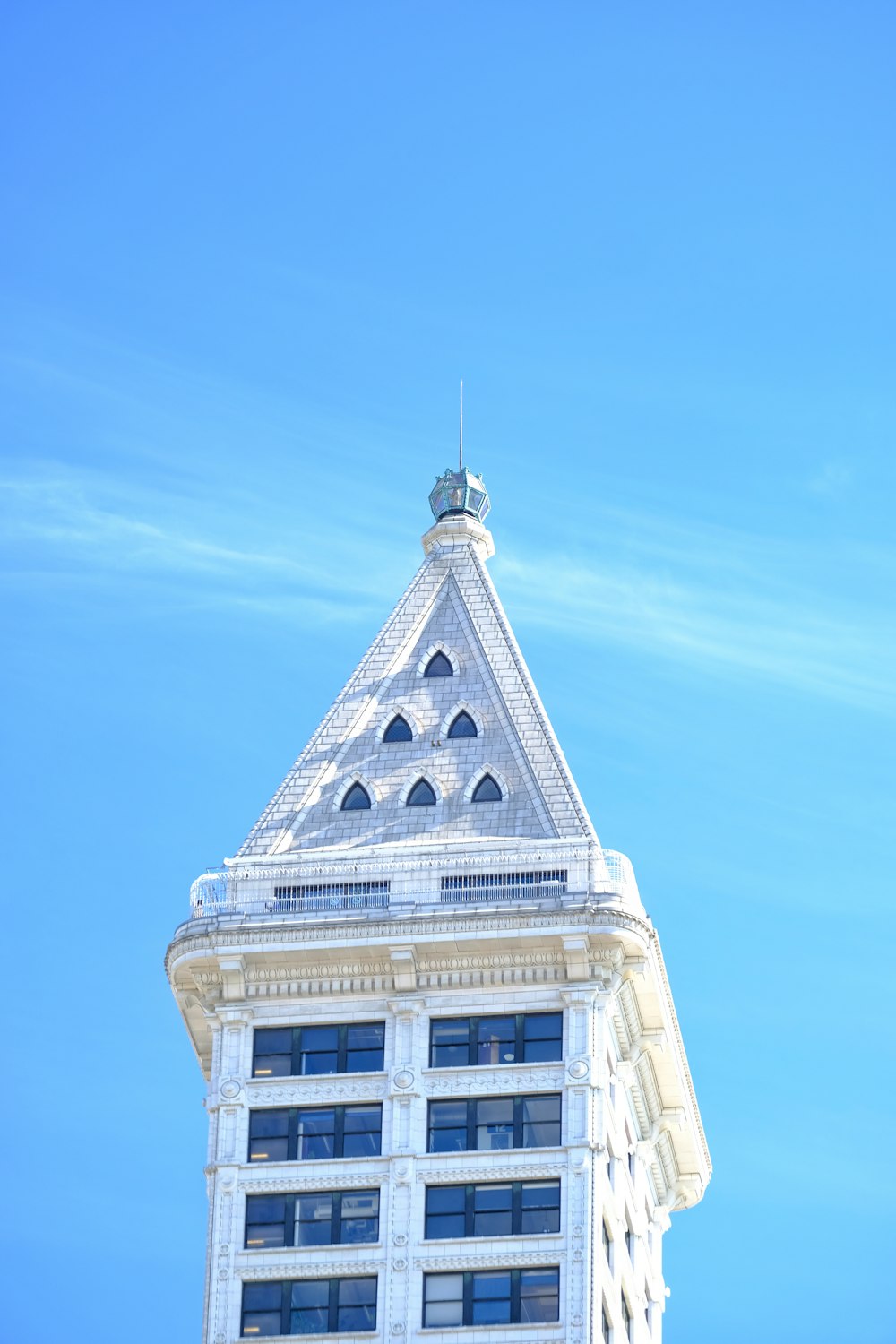 a tall building with a clock on the top of it