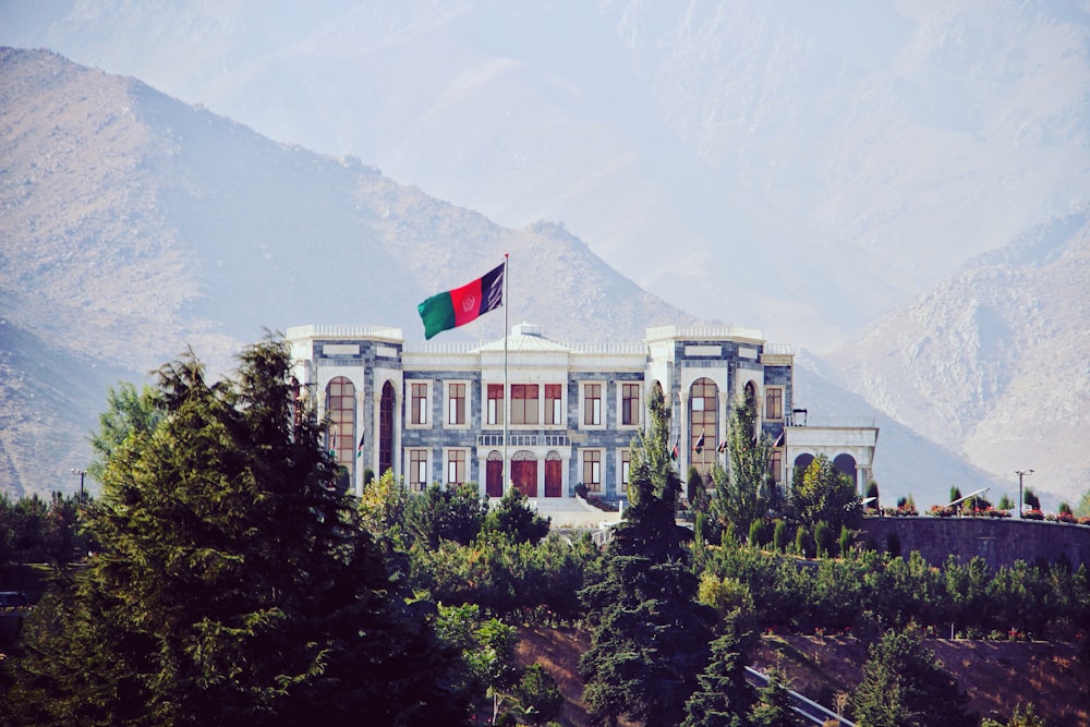 a large building with a flag on top of it