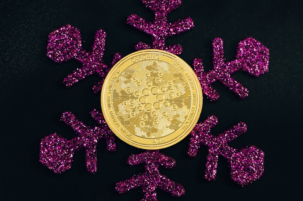 a bitcoin surrounded by pink glitter bows