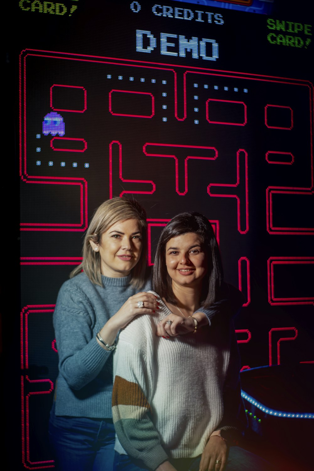 a couple of women standing next to each other