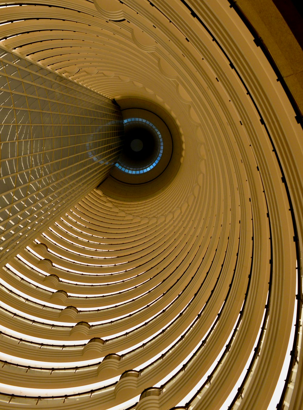 a circular ceiling with a blue light in the center