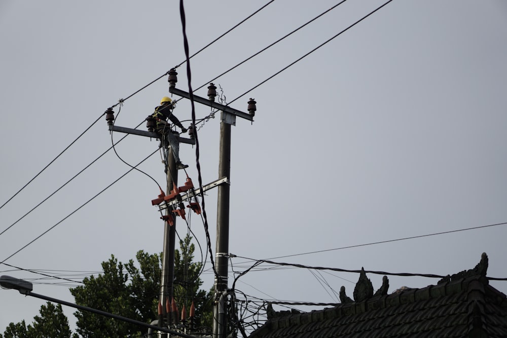 a man on a high voltage power line