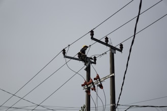 a power pole with power lines and wires